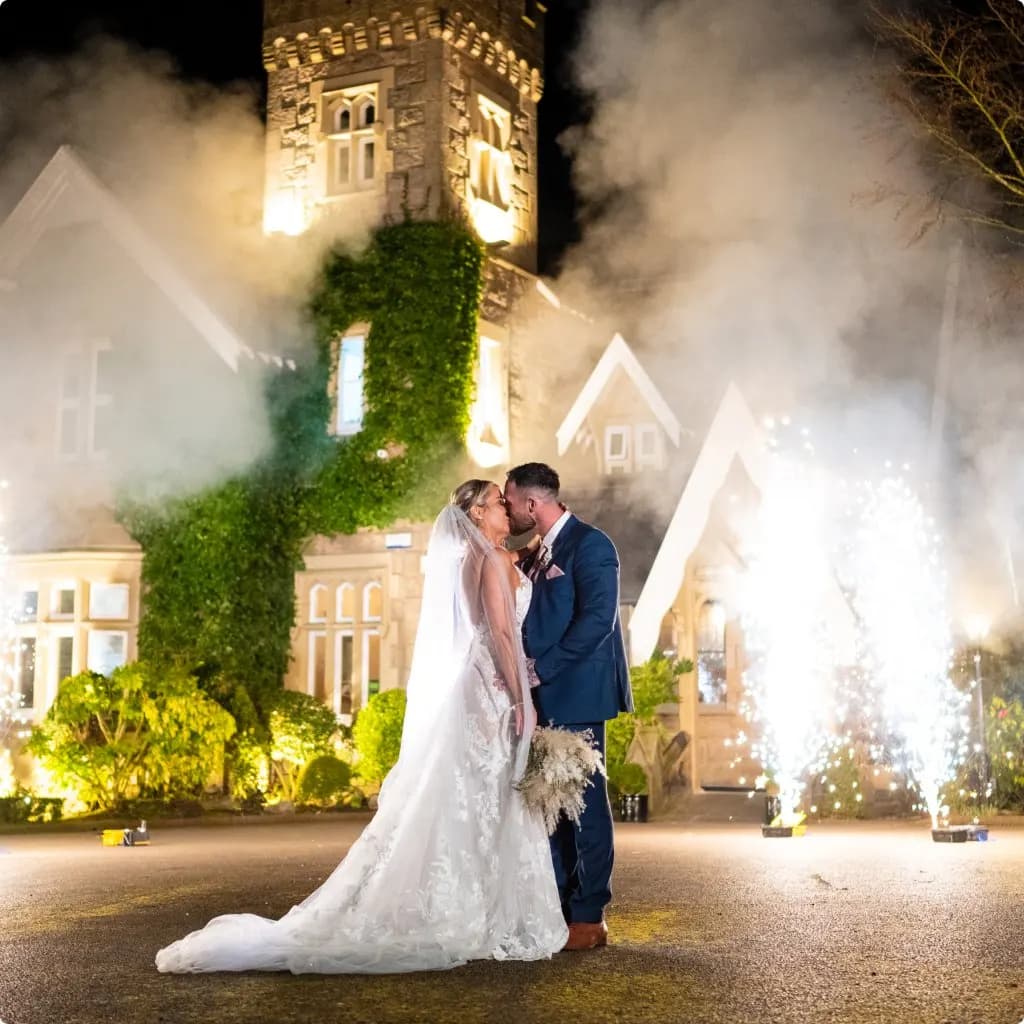A castle wedding venue lit up at night